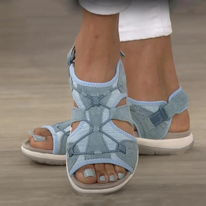 Verschillende kleuren Ursula Orthopedische Sandalen naast elkaar, inclusief blauw, roze en kaki.