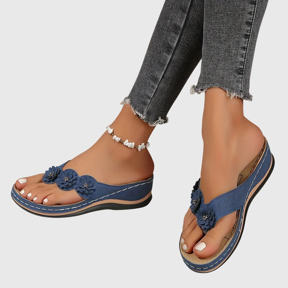 Groep Alexis™ orthopedische teenslippers in verschillende kleuren bij elkaar gepresenteerd