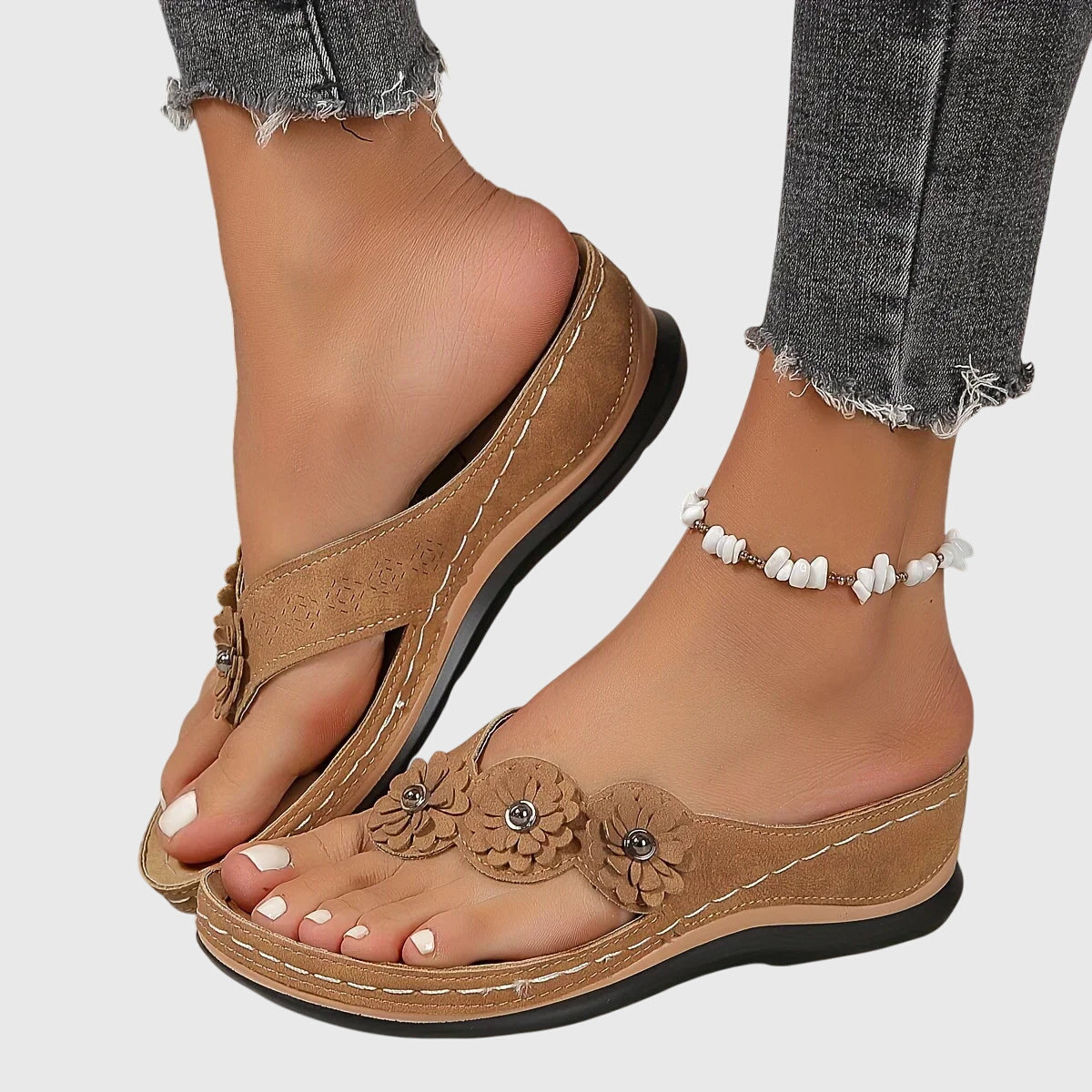 Bovenaanzicht van roze Alexis™ orthopedische teenslippers op een lichte ondergrond